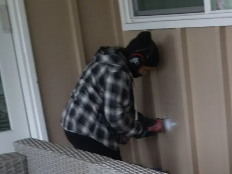 Professional electrician installing an exterior outlet in Paducah