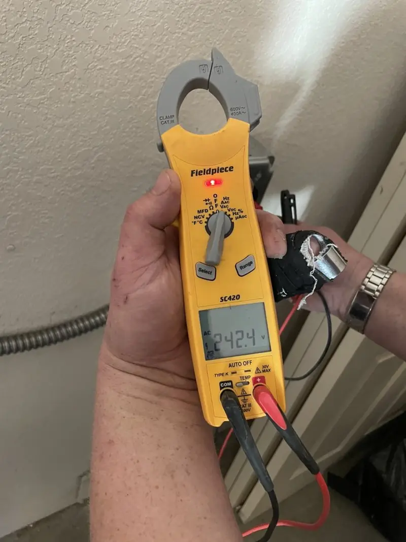 Voltage testing with clamp meter during Ceiling Fan Installation in Paducah